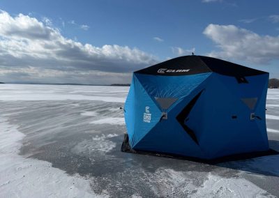 Blue Ice Shanty on Frozen Lake