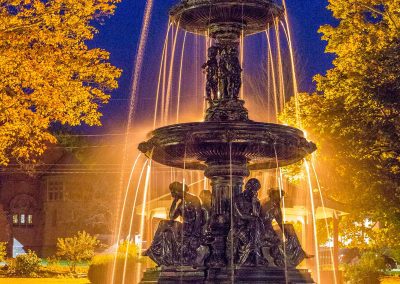 A view of "The Ladies" a fountain in Taylor Park Vermont at nighttime