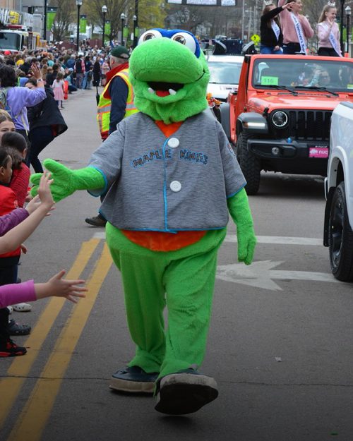 Lake Monsters Champ Mascot walking in a parade